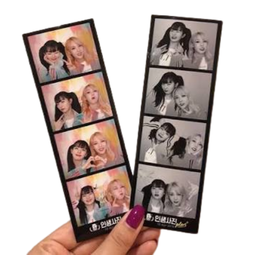 Photostrip prints held in hand—color and black & white